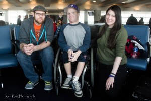 photo by Ken King Wheelchair Sports Federation media volunteers; (left to right) Matt Gephart, Eric Gissendanner, and Katier Harris; travelling to Sochi for the 2014 Winter Paralympics