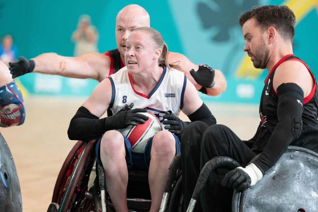 Sarah Adam fights through two Canadian defenders