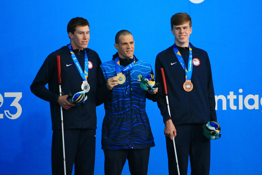Wilkerson and Rankine pose on the podium after each medaling.