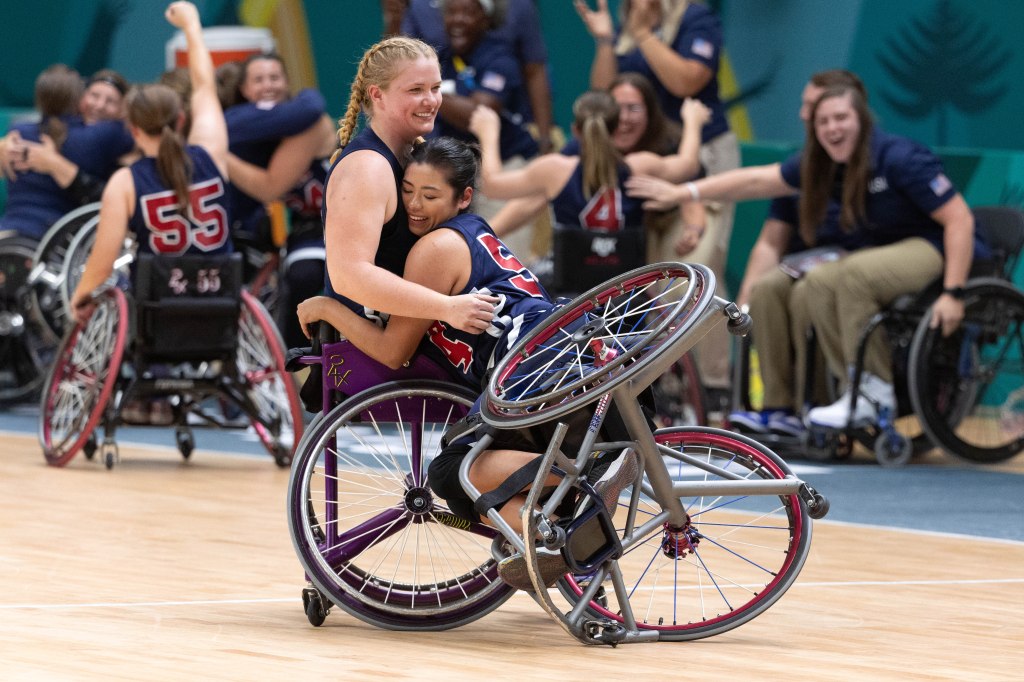 Ixhelt Gonzalez embraces Rose Hollermann on the court following Team USA's 62-56 win over Canada.